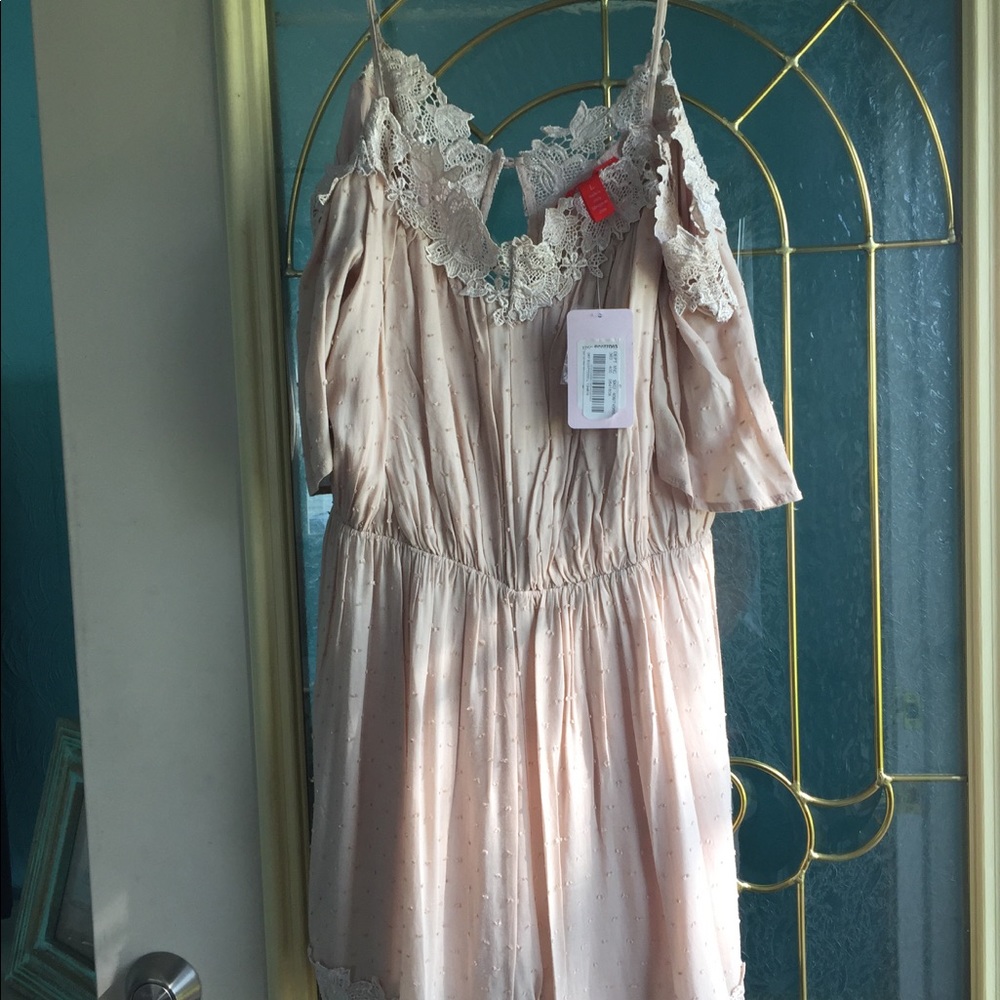 Cream colored romper, Chelsea and Violet brand L
